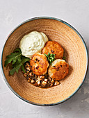 Fried potato fritters with tarragon cream and mushroom ragout