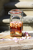 Love potion made of spices, rose petals, honey, and rum