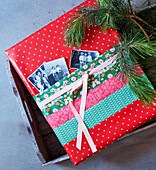 Christmas gift wrap with old photos in pocket