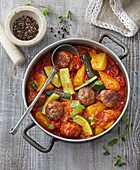 Meat balls with potatoes and tomatoes