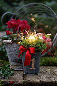 A New Year's flower arrangement with sparkler placed outdoors