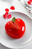 Heart-shaped strawberry dessert topped with jelly