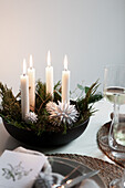 Black bowl with Advent arrangement on a set table
