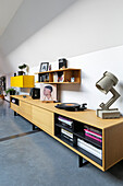 Low sideboard with record player in loft apartment