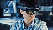 Electronics engineer wearing a virtual reality headset