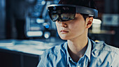 Electronics engineer wearing a virtual reality headset