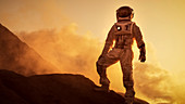 Silhouette of an astronaut standing on a mountain