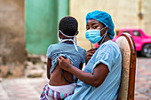 Doctor listening to child's chest