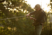Man casting fly fishing pole