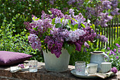 A lush bouquet of lilacs on the garden wall