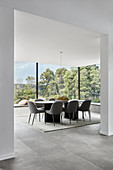Elegant dining area with panoramic glass walls