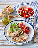 Coriander pork cutlets with tomato salad