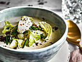 Cream of cauliflower soup with greens