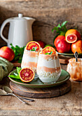 A layered desserts with blood orange curd and cottage cheese