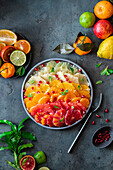 A citrus salad with pomegranate seeds