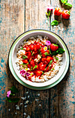 Cold coconut rice pudding with drunken strawberries