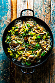 Shiitake rice noodle with bok choy in a pan