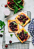 Vanilla and cherry pastries with mint