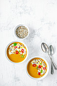 Yellow lentil cream soup with chili