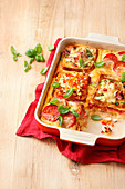 Sandwich lasagna with cheese, ham and tomatoes