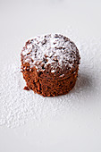 A chocolate cake with powdered sugar