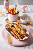 Sesame turkey sticks with sweet potato fries