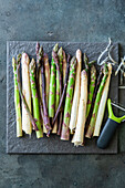 Fresh green, purple and white asparagus