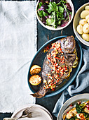 Barbecued bream with spring onions, lemon and chilli