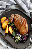 Roasted duck breast in peach sauce