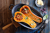 Roasted butternut squash stuffed with minced meat and cheese