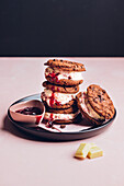 Ice cream sandwiches with chocolate chip cookies and cherries