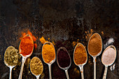 Variety of spices on silver spoons