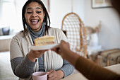 Excited woman reaching for slice of cake
