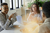 Business people talking in morning office meeting