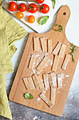 Homemade fresh pizzoccheri on a wooden board