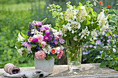 Early summer bouquets of snowball blossoms, roses, columbines, lupins and knapweeds