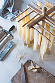 Drying homemade pasta on a pasta stand