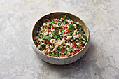 Vegan quinoa salad with peas, radishes and mint