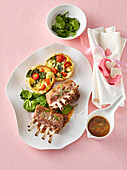Lamb cutlets with spinach and tomato quiche