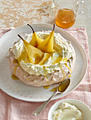 Meringue Pavlova with baked pears