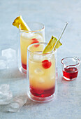 Pineapple lemonade with cherry syrup