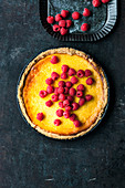 A cheesecake tart with raspberries