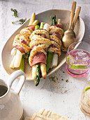 Baked asparagus parcels wrapped in wine-cured ham