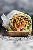 Burrito roll with lettuce, meat and vegetables