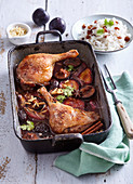 Baked duck legs with plums