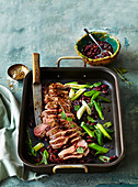 Lamb roast with beans and spring onion