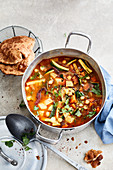 Chickpea-vegetable stew with kohlrabi and Indian puri
