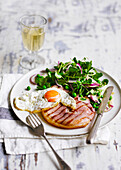 Gammon and egg with watercress and pea salad