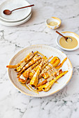 Roasted Parsnips with Tahini and Sesame Seeds