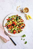 Grilled courgettes with tomatoes and olives